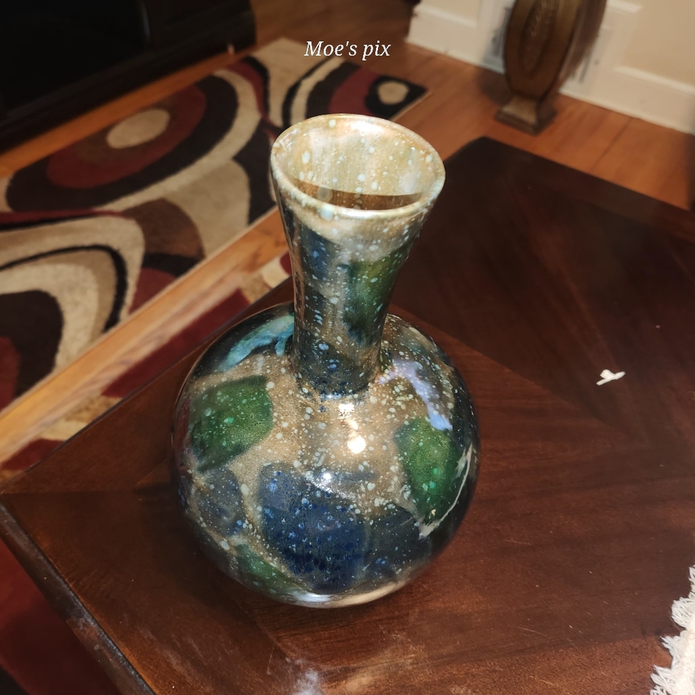 Brown vase with shades of green and blue